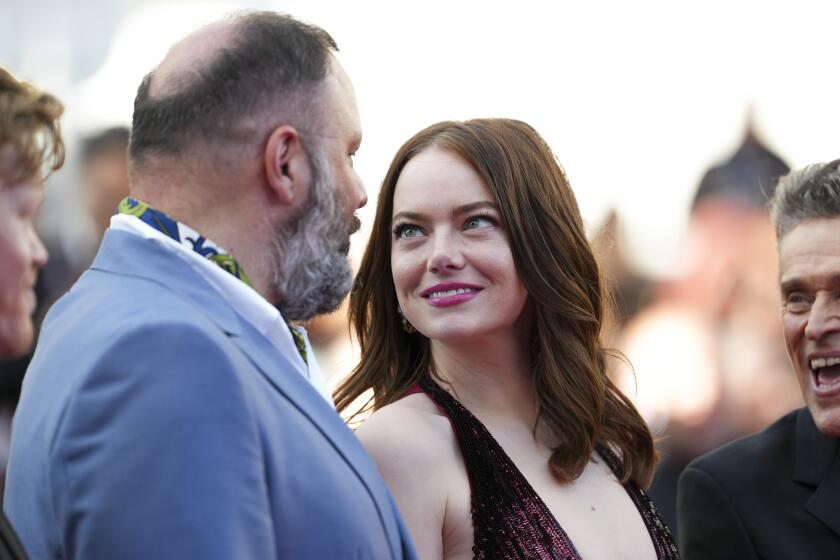Director Yorgos Lanthimos, left, and Emma Stone pose for photographers upon arrival at the premiere of the film 'Kinds of Kindness' at the 77th international film festival, Cannes, southern France, Friday, May 17, 2024. (Photo by Scott A Garfitt/Invision/AP)