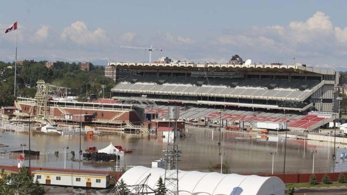 Floodwaters from the Elbow River cover the grandstand and track area at the Calgary Stampede grounds.
