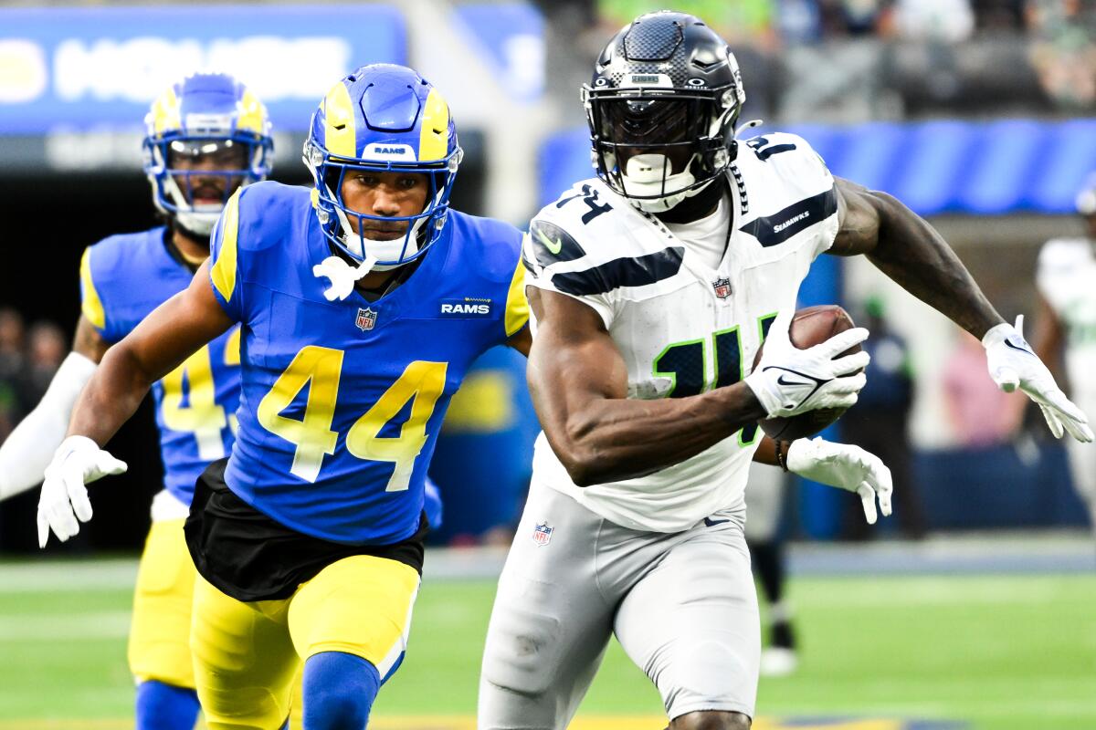 Los Angeles Rams' Ahkello Witherspoon chases Seattle Seahawks' DK Metcalf