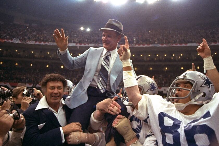 FILE - In this Jan. 15, 1978, file photo, Dallas Cowboys head coach Tom Landry is given a victory ride after the team defeated the Denver Broncos in NFL football's Super Bowl XII in New Orleans. The Cowboys evened their Super Bowl record at 2-2 by taking advantage of eight Broncos turnovers. (AP Photo/File)
