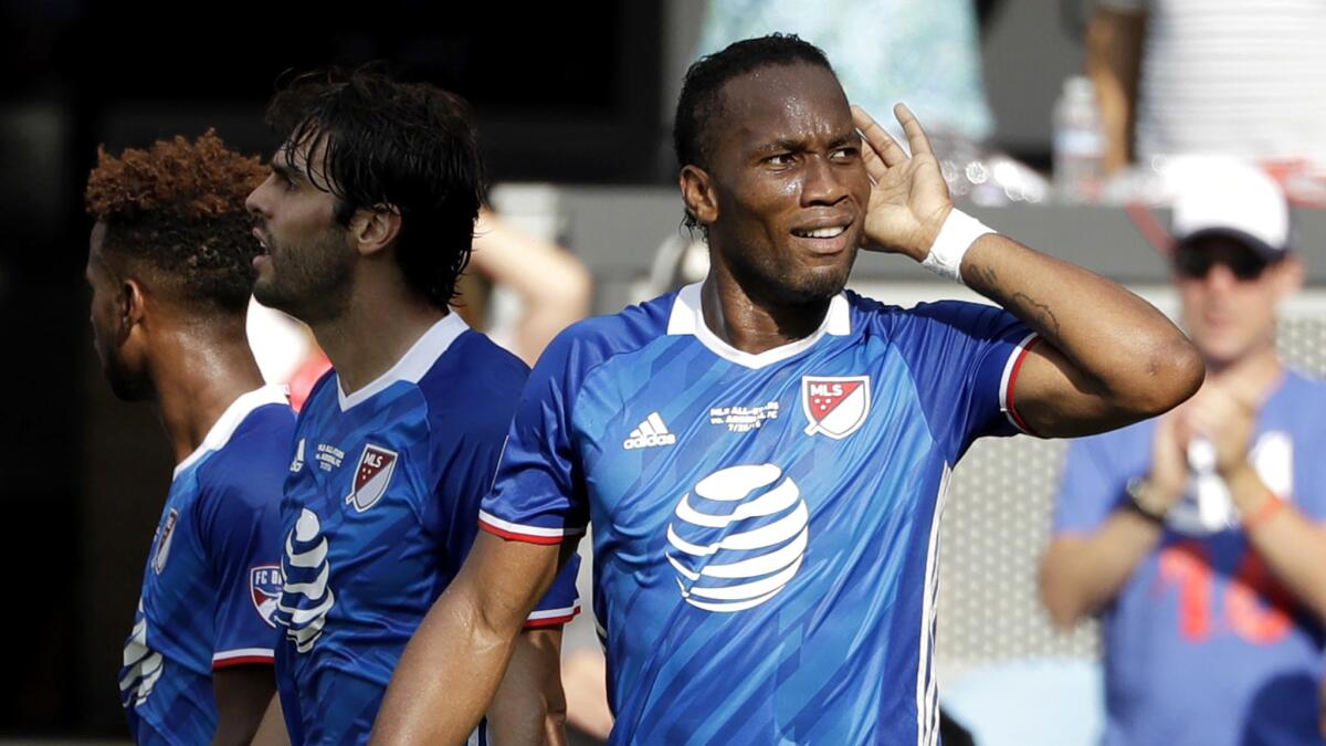 MLS All-Star Didier Drogba celebrates after scoring against Arsenal during the first half Thursday.