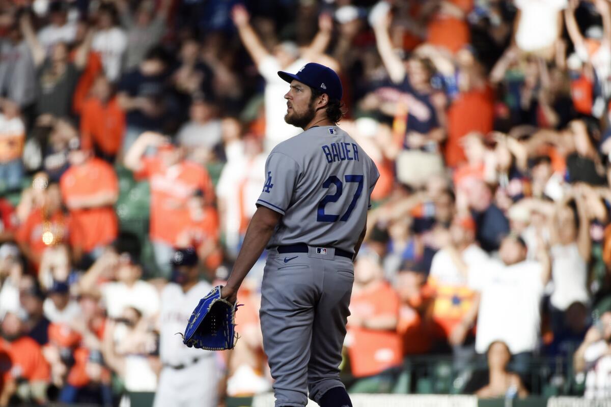 Dodgers starting pitcher Trevor Bauer watches a solo home run hit by Houston's Jose Altuve.