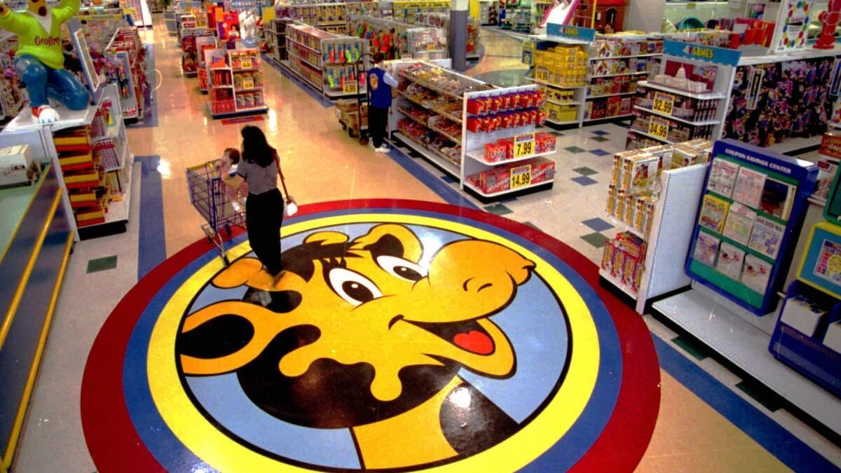 A floor decal at a Toys R Us store in 1996 shows the chain's mascot, Geoffrey the Giraffe.