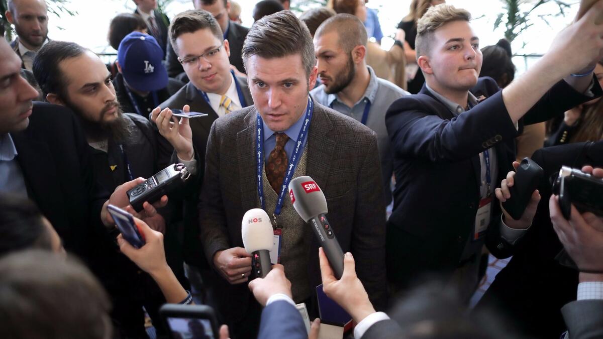 Reporters surround white nationalist Richard Spencer at the Conservative Political Action Conference in National Harbor, Md.