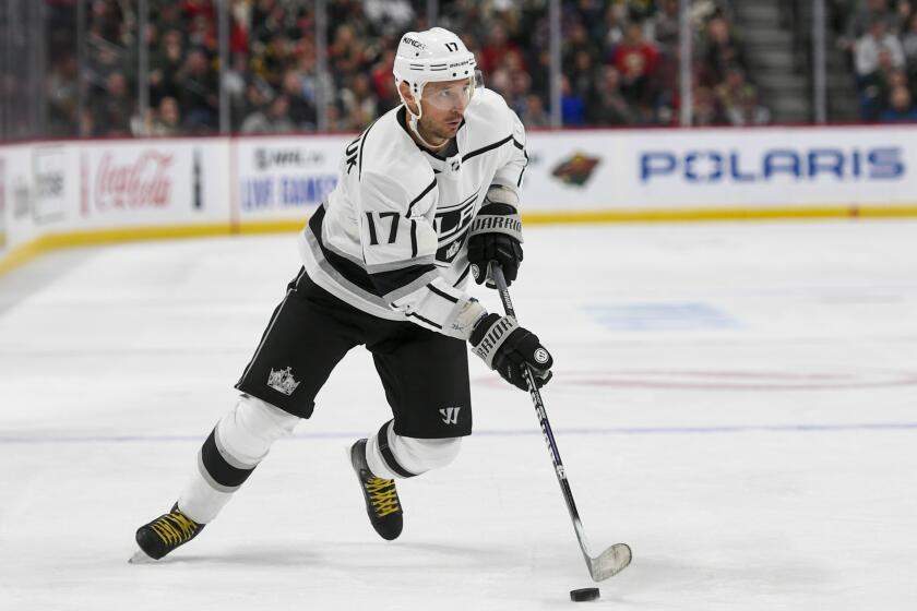 Los Angeles Kings wing Ilya Kovalchuk takes the puck against the Minnesota Wild during the second period of an NHL hockey game Saturday, Oct. 26, 2019, in St. Paul, Minn. (AP Photo/Craig Lassig)