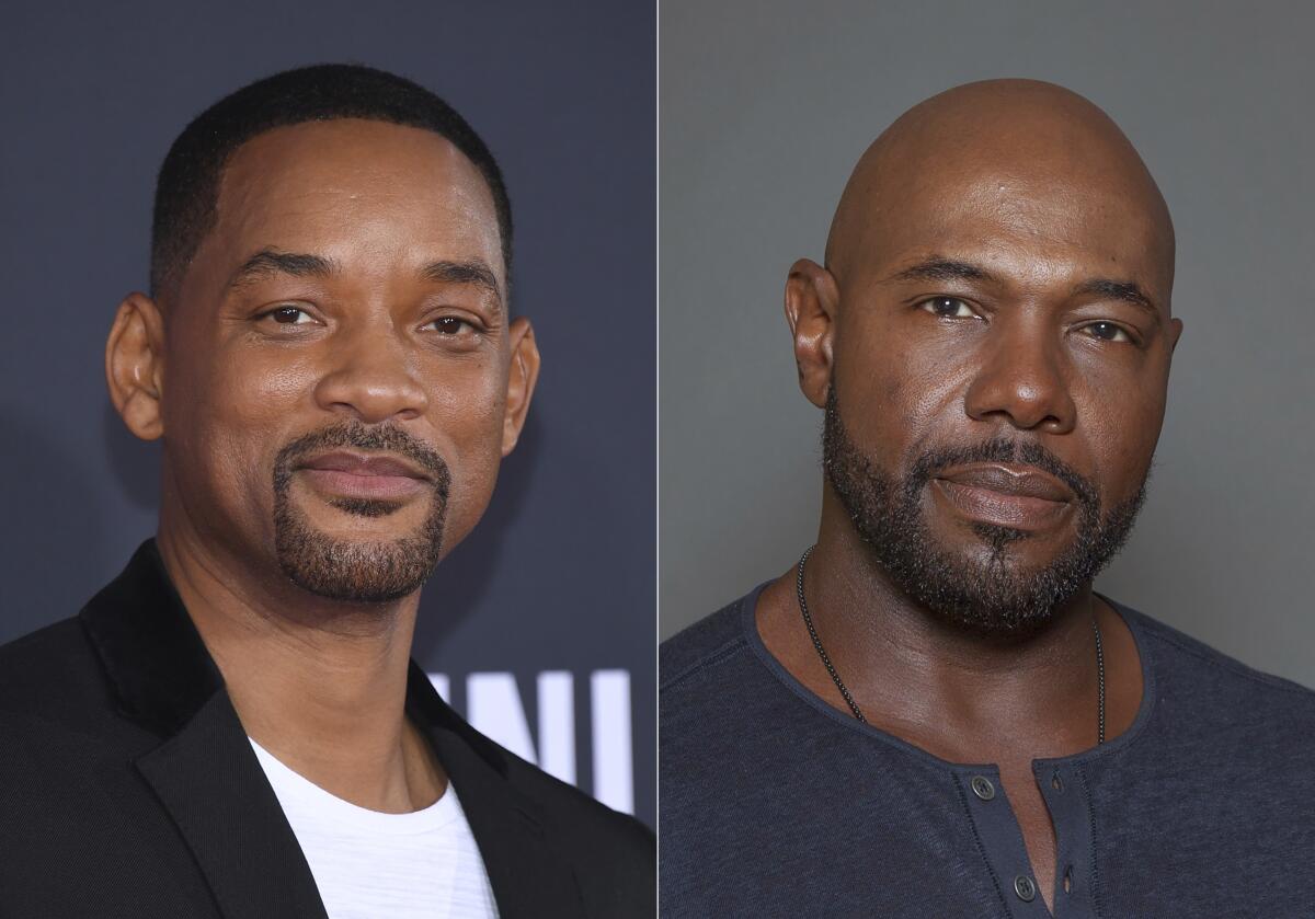 Will Smith attends the premiere of "Gemini Man" in Los Angeles on Oct. 6, 2019, left, and director Antoine Fuqua appears during a photo session in Los Angeles on July 12, 2015. Smith and director Fuqua have pulled production of their runaway slave drama “Emancipation” from Georgia over the state’s recently enacted law restricting voting access. The film is largest and most high profile Hollywood production to depart the state since Georgia’s Republican-controlled state Legislature passed a law that introduced stiffer voter identification requirements for absentee balloting. (AP Photo)