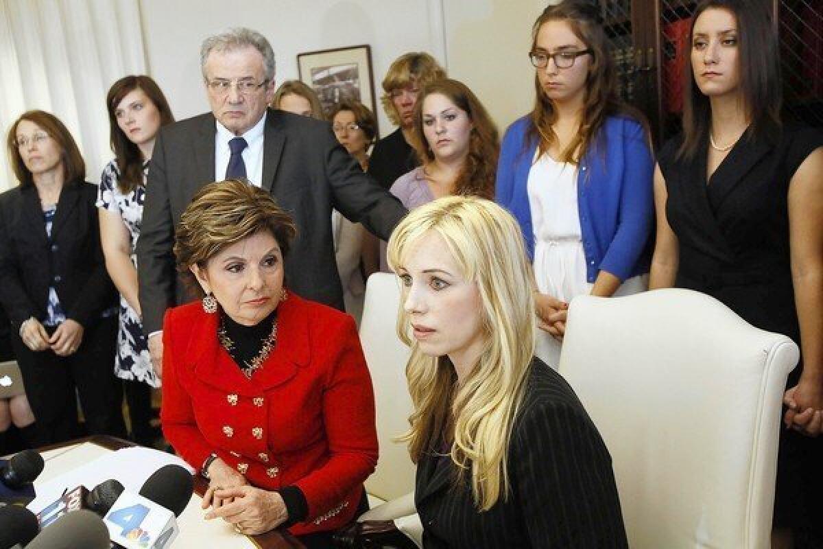 Attorney Gloria Allred, sitting at left, and Dr. Caroline Heldman, professor of politics, at a news conference in April to announce the filing of a complaint against Occidental College regarding alleged "deliberate indifference to rape victims" by the university.
