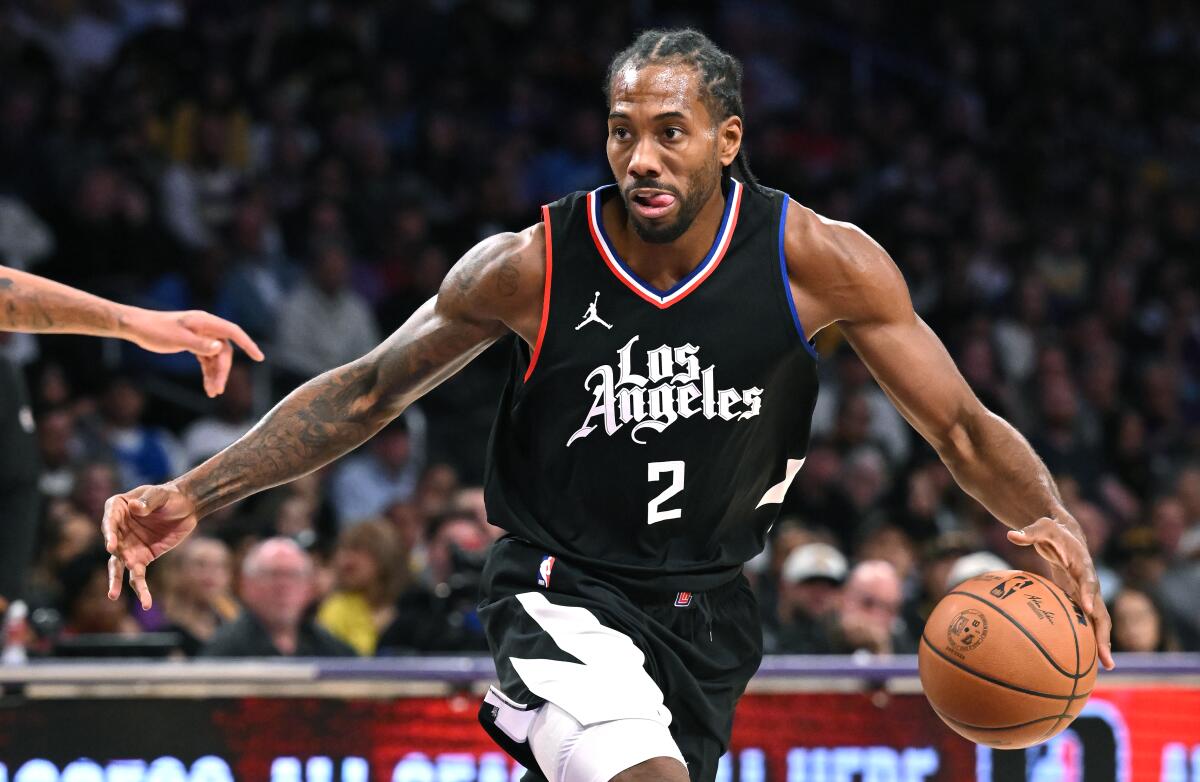 Clippers star Kawhi Leonard controls the ball during a game against the Lakers in November.