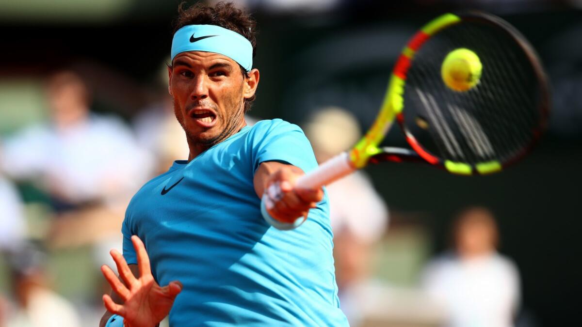 Rafael Nadal returns a shot against Juan Martin del Potro during their semifinal match Friday at the French Open.