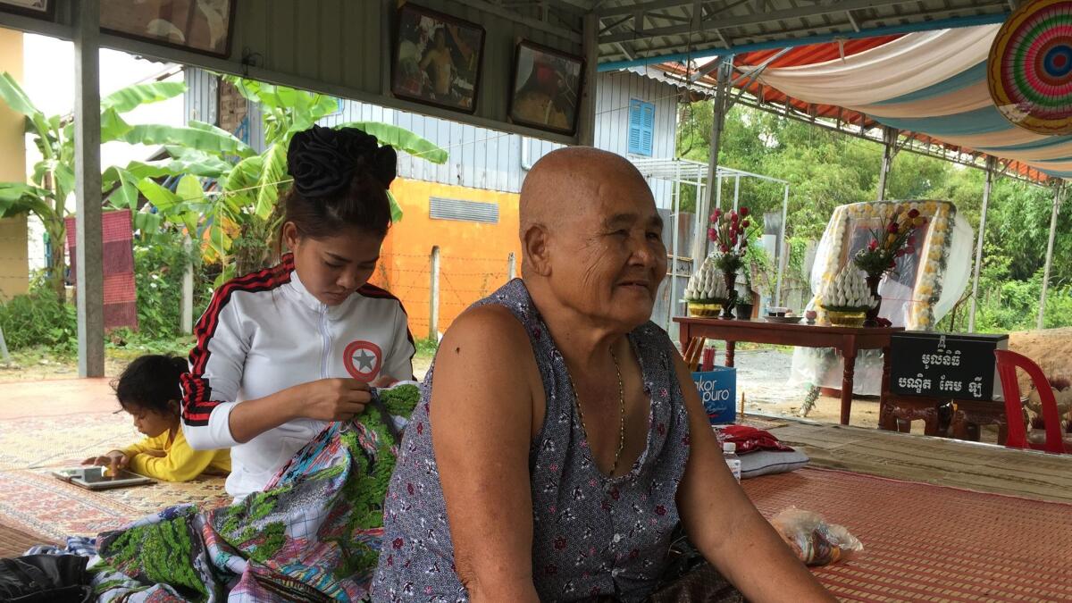 Pok Sin, Kem Ley's 78-year-old mother, sits at the family's home in Takeo province receiving a steady stream of mourners.