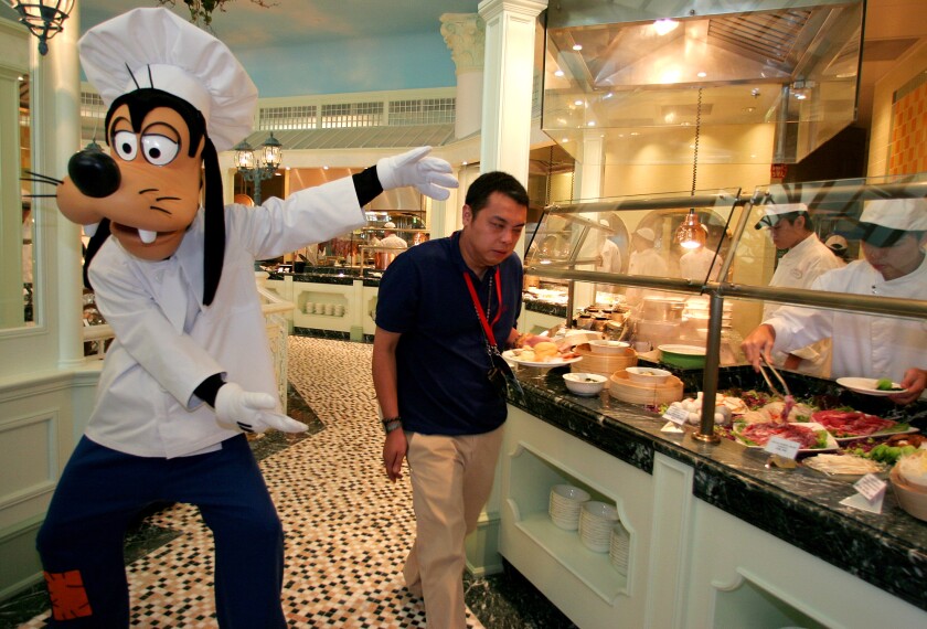 Disney character Goofy poses at a restaurant at Hong Kong Disneyland Resort in 2005.
