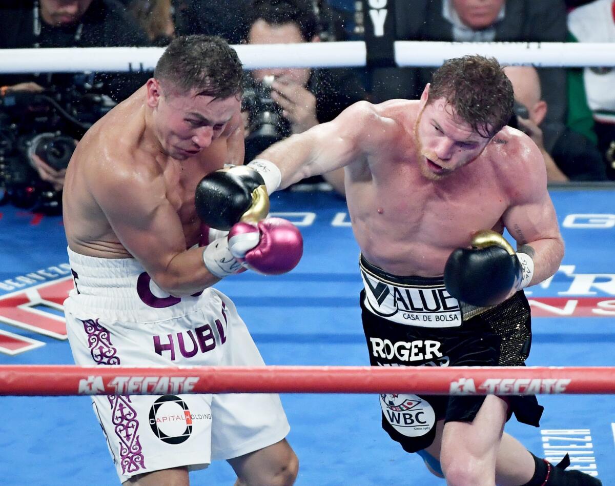 LAS VEGAS, NV - SEPTEMBER 15: Canelo Alvarez (R) throws a right at Gennady Golovkin in the fifth round of their WBC/WBA middleweight title fight at T-Mobile Arena on September 15, 2018 in Las Vegas, Nevada. Alvarez won by majority decision. (Photo by Ethan Miller/Getty Images) ** OUTS - ELSENT, FPG, CM - OUTS * NM, PH, VA if sourced by CT, LA or MoD **