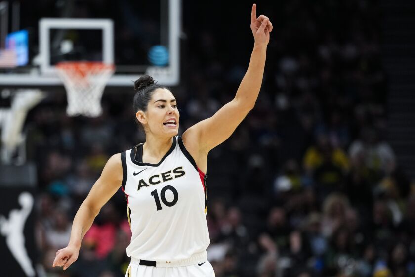 Las Vegas Aces guard Kelsey Plum (10) reacts after making a basket against the Seattle Storm during the second half of a WNBA basketball game Saturday, May 20, 2023, in Seattle. The Aces won 105-64. (AP Photo/Lindsey Wasson)