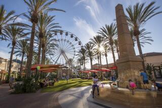 IRVINE, CALIF. -- FRIDAY, AUGUST 31, 2018: A view of shoppers taking advantage of the re-designed Irvine Spectrum Center, where 30 new merchants have replaced the old Macy's anchor store. The Irvine Spectrum Center is spending heavily to keep people coming (a $200 million expansion), Photos taken at Irvine Spectrum Center in Irvine, Calif., on Aug. 31, 2018. (Allen J. Schaben / Los Angeles Times)