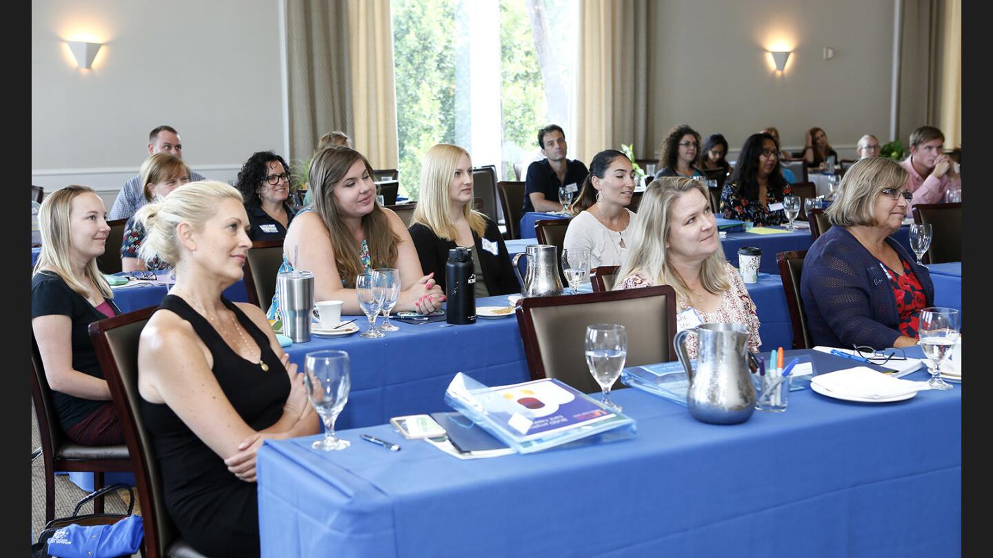 Some of the 52 new Burbank Unified School District teachers listen to Superintendent Matt Hill during new teacher orientation day at Castaway in Burbank on Thursday, Aug. 3, 2017.