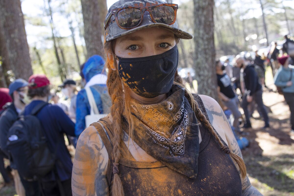 Environmental activists hold a rally and a march through the Atlanta Forest.
