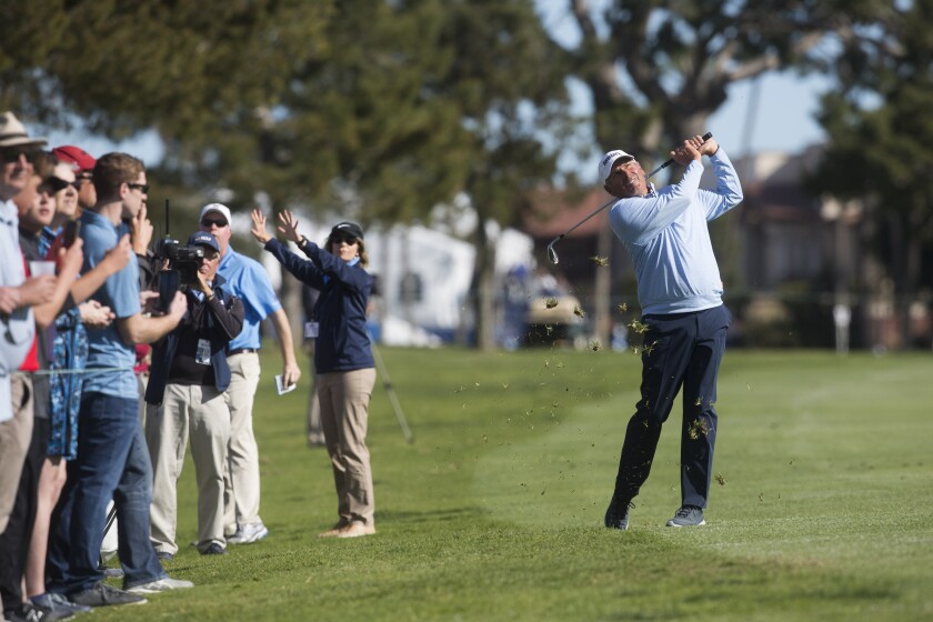 Fred Couples hits the ball onto the green of the 16th hole during the final round of the Hoag Classic at Newport Beach Country Club on Sunday.