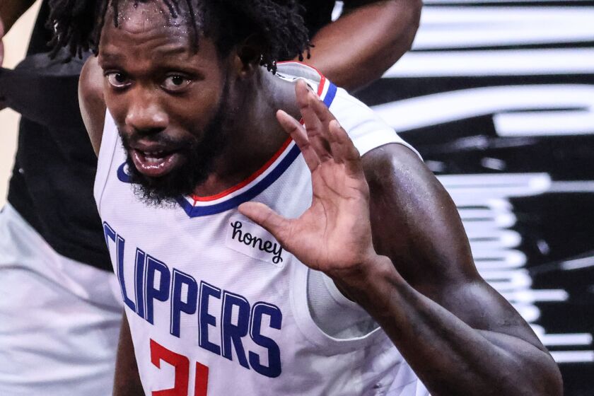 Monday, June 28, 2021, Phoenix, Arizona -LA Clippers guard Patrick Beverley (21) engages with fans as the Clippers beat the Phoenix Suns in Game five of the NBA Western Conference Finals at Phoenix Suns Arena. (Robert Gauthier/Los Angeles Times)