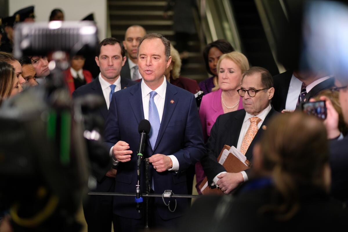 El congresista Adam B. Schiff (D-Burbank) habla en el Capitolio el viernes. Schiff es uno de los siete fiscales del Congreso que presentaron pruebas en el juicio de destitución contra el presidente Trump esta semana.