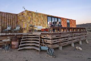 A Pioneertown house made of converted shipping containers has been painted in a collage of desert sunset hues. 
