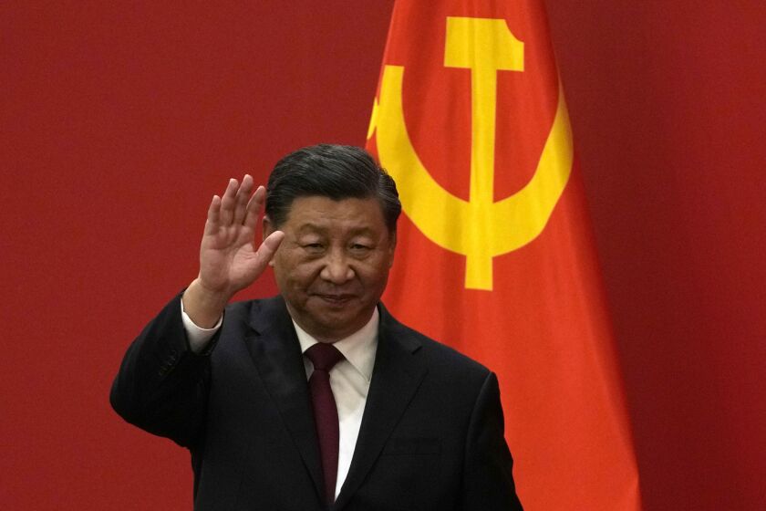 FILE - Chinese President Xi Jinping waves at an event to introduce new members of the Politburo Standing Committee at the Great Hall of the People in Beijing on Oct. 23, 2022. Barely a month after granting himself new powers as China’s possible leader for life, Xi is facing a wave of public anger of the kind not seen for decades, sparked by his draconian “zero-COVID” program that will soon enter its fourth year. (AP Photo/Andy Wong, File)