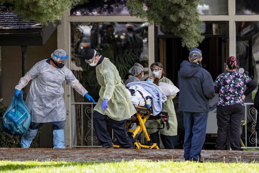 RIVERSIDE, CA- APRIL 8, 2020: Patients are removed from Magnolia Rehabilitation and Nursing Center after 39 tested positive for coronavirus and nursing staff was not showing up to work for their own safety on April 8, 2020 in Riverside, California.(Gina Ferazzi / Los Angeles Times)