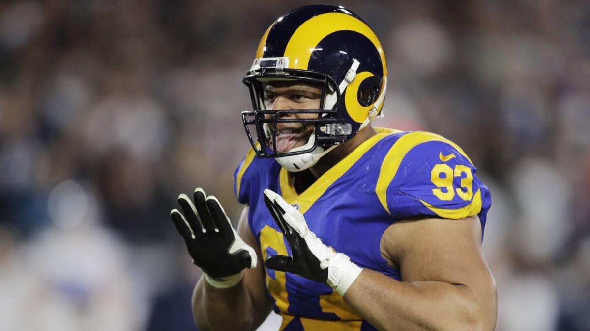 Rams defensive lineman Ndamukong Suh celebrates after scoring during the second half in an NFL divisional football playoff game against the Dallas Cowboys on Jan. 12, 2019.