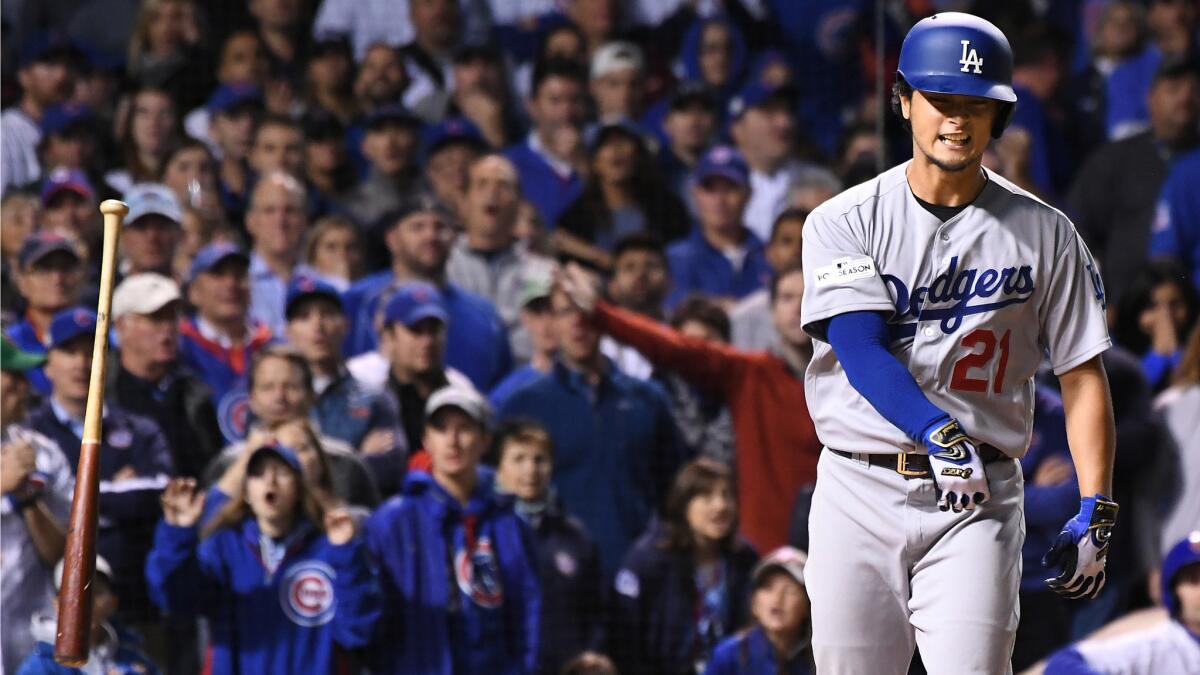 Yu Darvish tosses his bat after walking with the bases loaded.