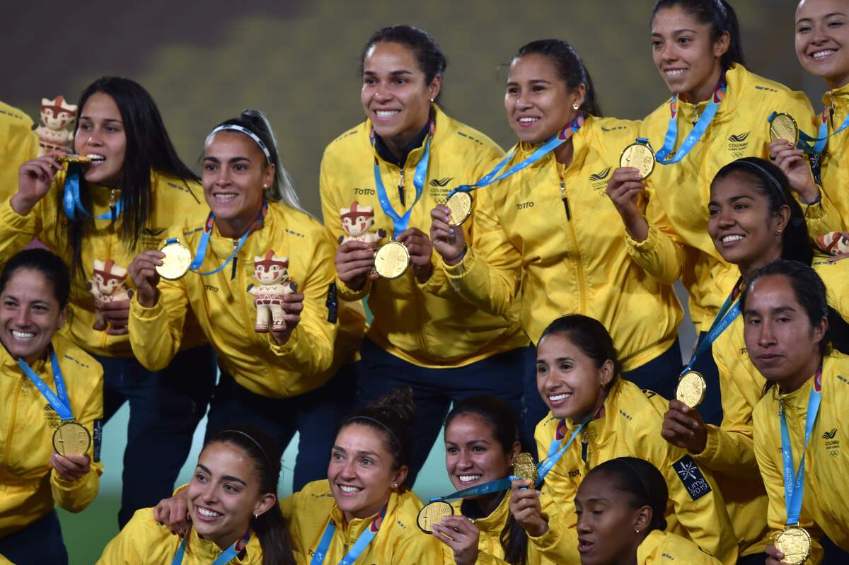 Colombia's players pose on the podium with their gold medals after defeating Argentina during their Women's Gold Medal Football Match of the Lima 2019 Pan-American Games in Lima on August 9, 2019. (Photo by CRIS BOURONCLE / AFP)CRIS BOURONCLE/AFP/Getty Images ** OUTS - ELSENT, FPG, CM - OUTS * NM, PH, VA if sourced by CT, LA or MoD **