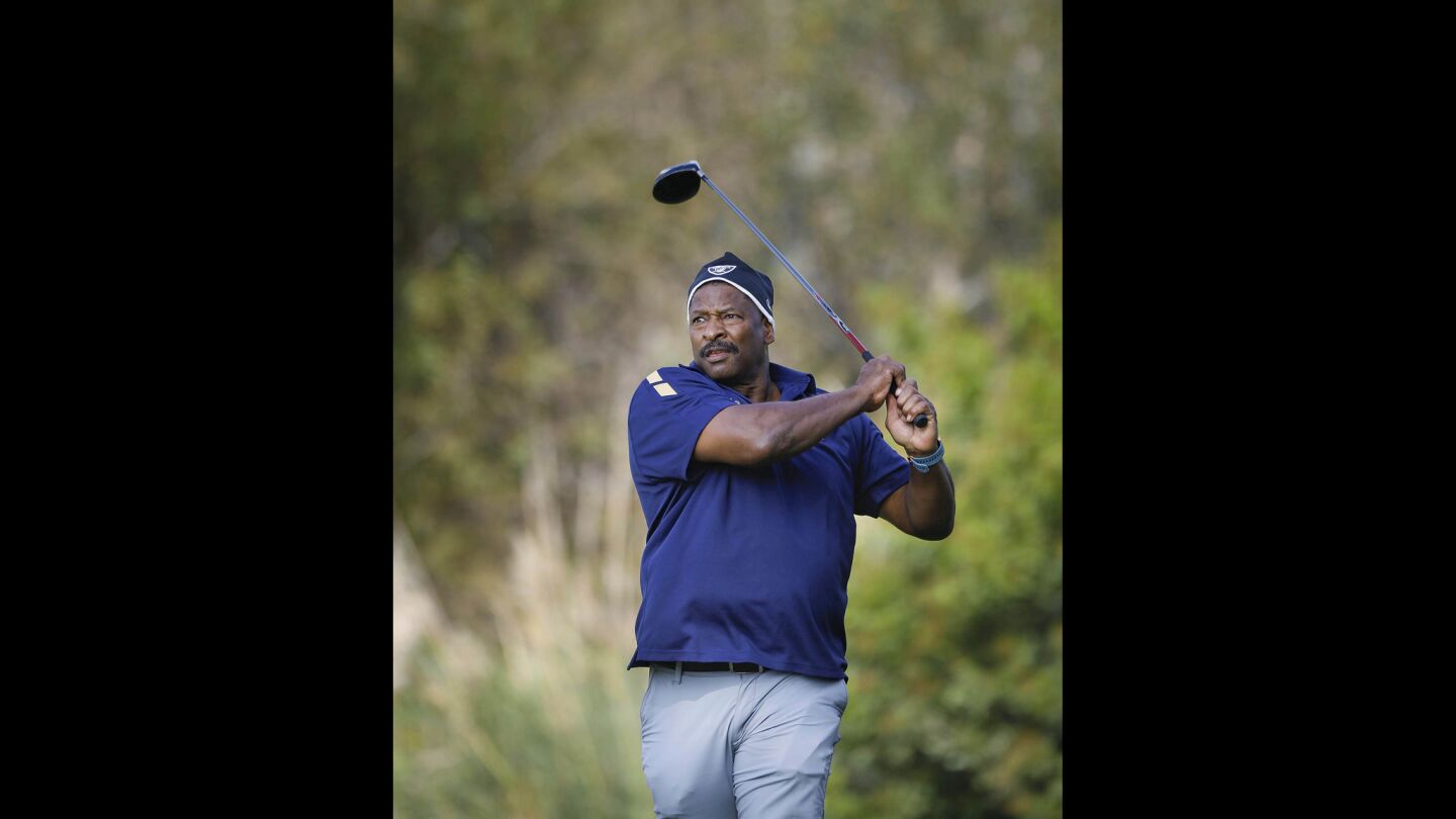 Napoleon McCallum who played football for the U.S. Naval Academy and Oakland Raiders, tees off on the second hole during the Navy-Notre Dame Golf Tournament at the Riverwalk Golf Club in Mission Valley in advance of the football game between the two schools to be held at SDCCU Stadium, Saturday.