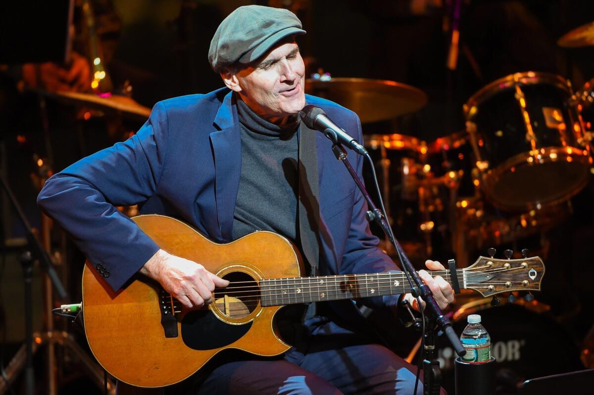 James Taylor, shown above, will hit the road with Jackson Browne next year. The two postponed their 2020 joint tour because of the novel coronavirus pandemic.