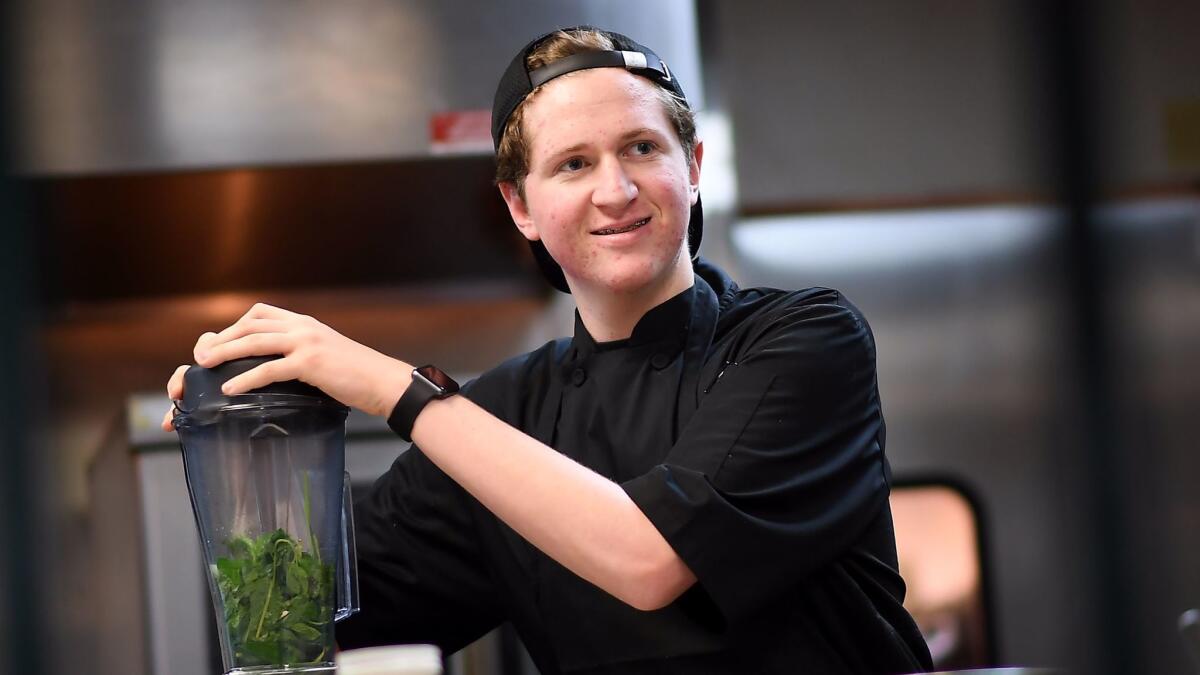 Holden Dahlerbruch, 16, works in the kitchen at the Wallace in Culver City.