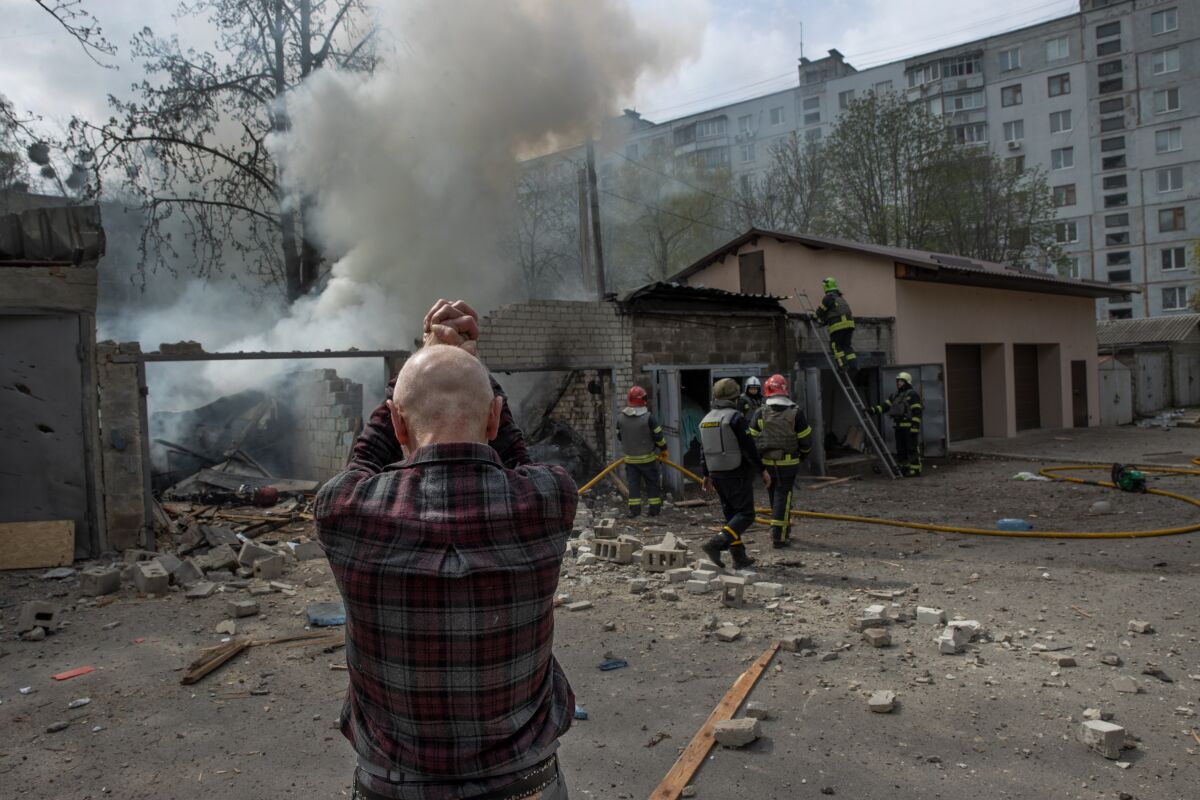 A local resident reacts after a Russian attack on a residential area in Kharkiv, in northeastern Ukraine.