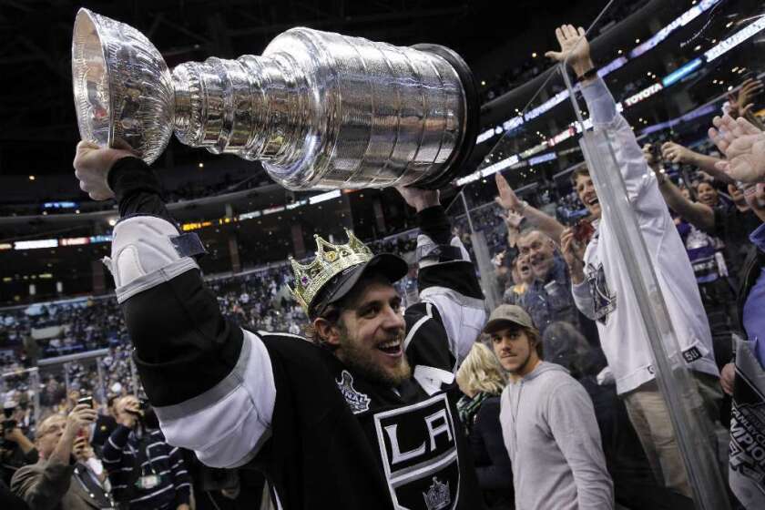 Los Angeles Kings center Anze Kopitar gives fans an up-close look at the Stanley Cup after L.A. defeated the New Jersey Devils to claim the trophy at Staples Center.