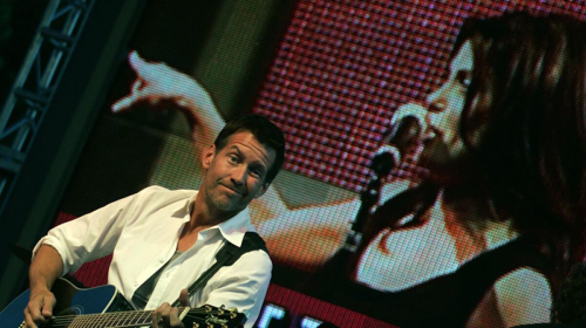 ONSTAGE: James Denton accompanies Desperate Housewives costar Teri Hatcher during the show Saturday.