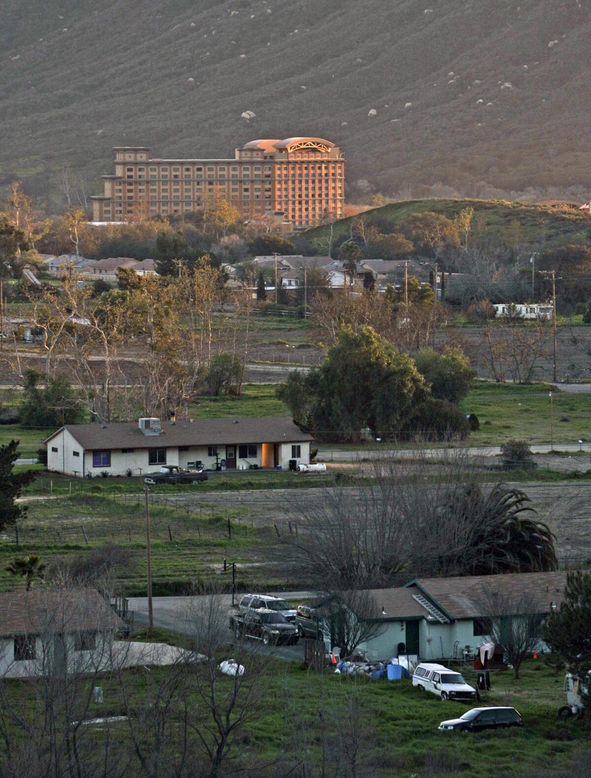 The Pala Casino looms in the background of the homes (foreground) on the Pala Indian Reservation.