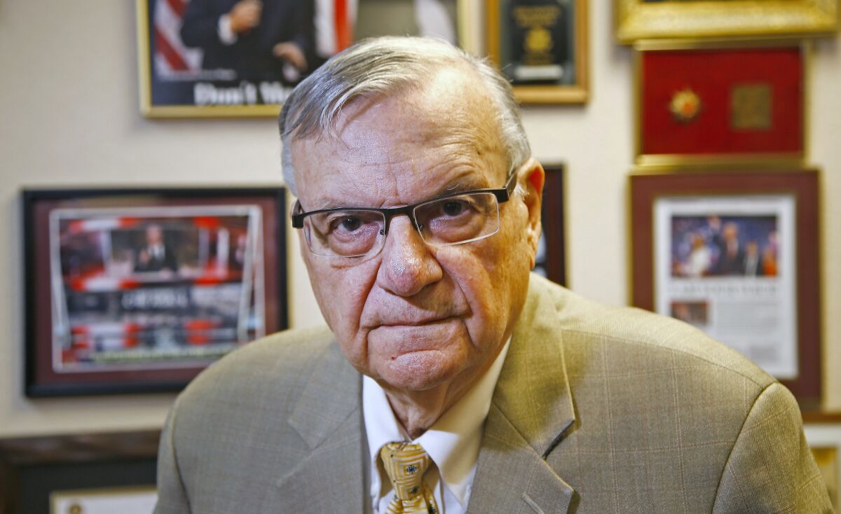 FILE - In this Aug. 26, 2019, file photo, former Maricopa County Sheriff Joe Arpaio poses for a portrait at his private office in Fountain Hills, Ariz. Arpaio announced on Tuesday, Oct. 5, 2021, that he's running in the 2022 mayor's race in Fountain Hills, Ariz. After getting crushed by a Democratic challenger in 2016 after 24 years as sheriff, Arpaio finished third in a Republican primary for a U.S. Senate seat in 2018 and second in the GOP primary in a 2020 bid to win back the sheriff's post. (AP Photo/Ross D. Franklin, File)