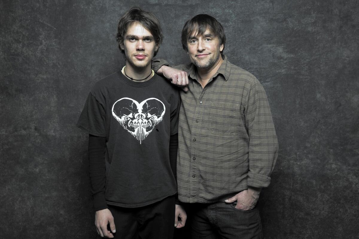 "Boyhood," which stars Ellar Coltrane, left, and was directed by Richard Linklater seems like both an awards front-runner and underdog. Its early tests arrive this week with the announcement of SAG and Golden Globes nominations.