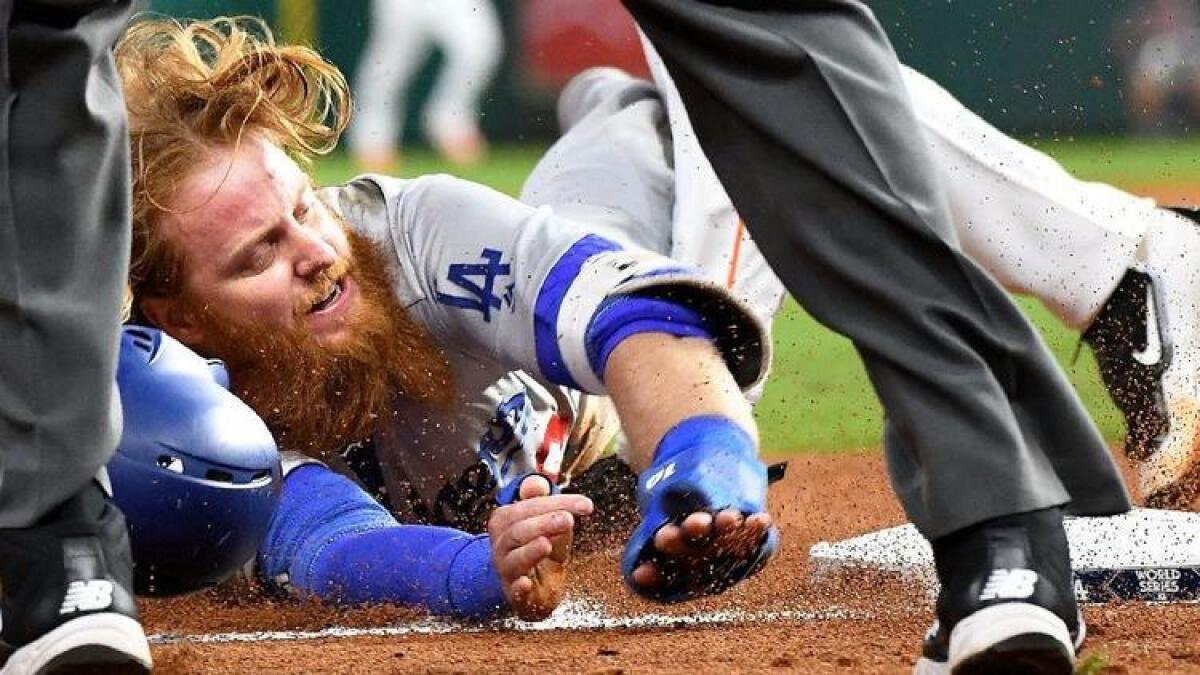 Justin Turner is tagged out at third base in Game 5.