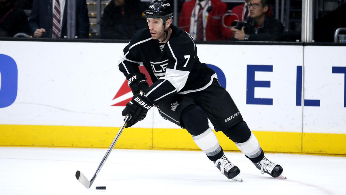 Kings defenseman Rob Scuderi brings the puck out of the corner against the Bruins during a game March 29.