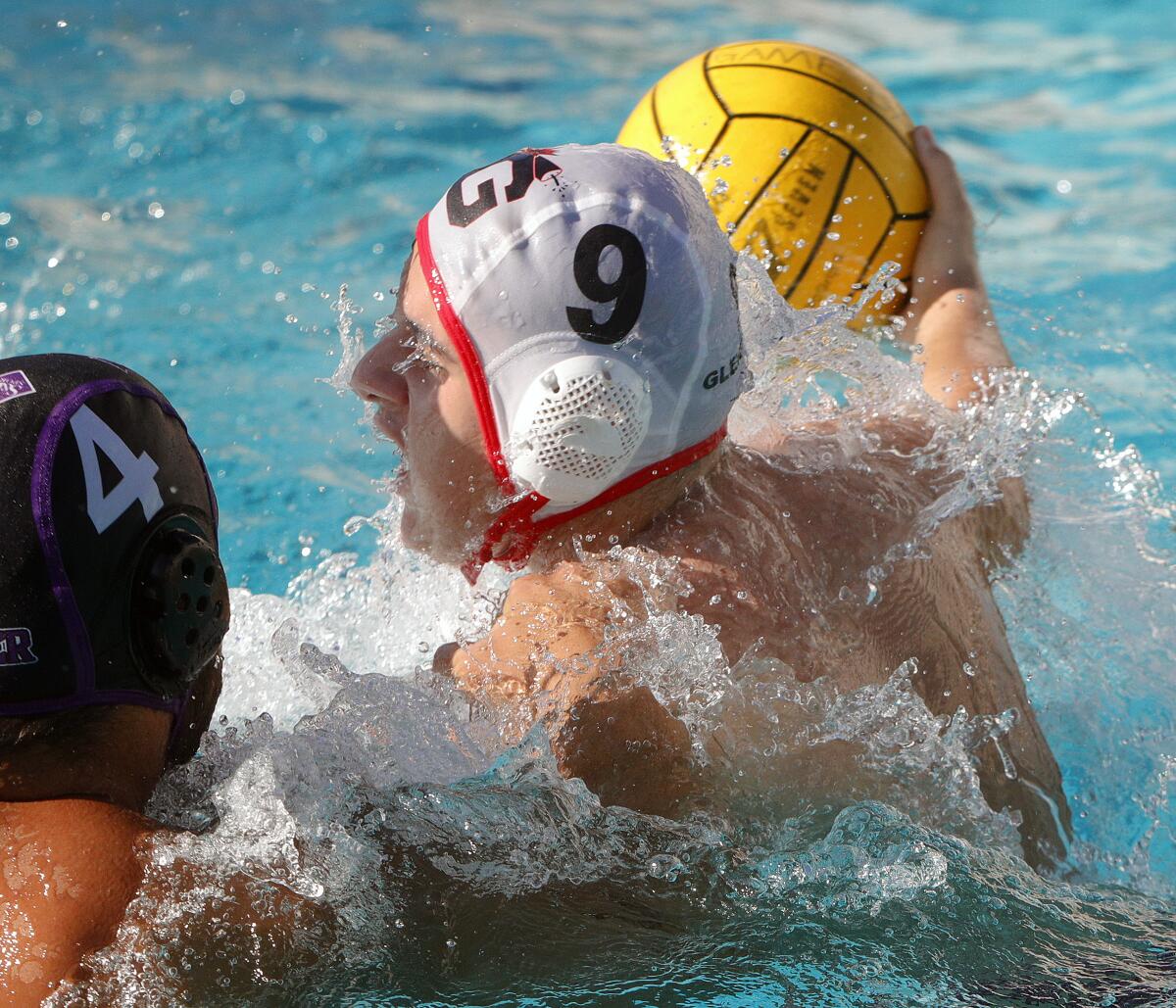 Glendale's Rudolf Hovhannisyan aggressively turns to shoot on Hoover's Hayk Nazaryan but not score in a Pacific League boys' water polo match at Hoover High School on Wednesday, October 23, 2019. Hoover defeated Glendale 12-11 after coming from behind in the fourth quarter to win the match.