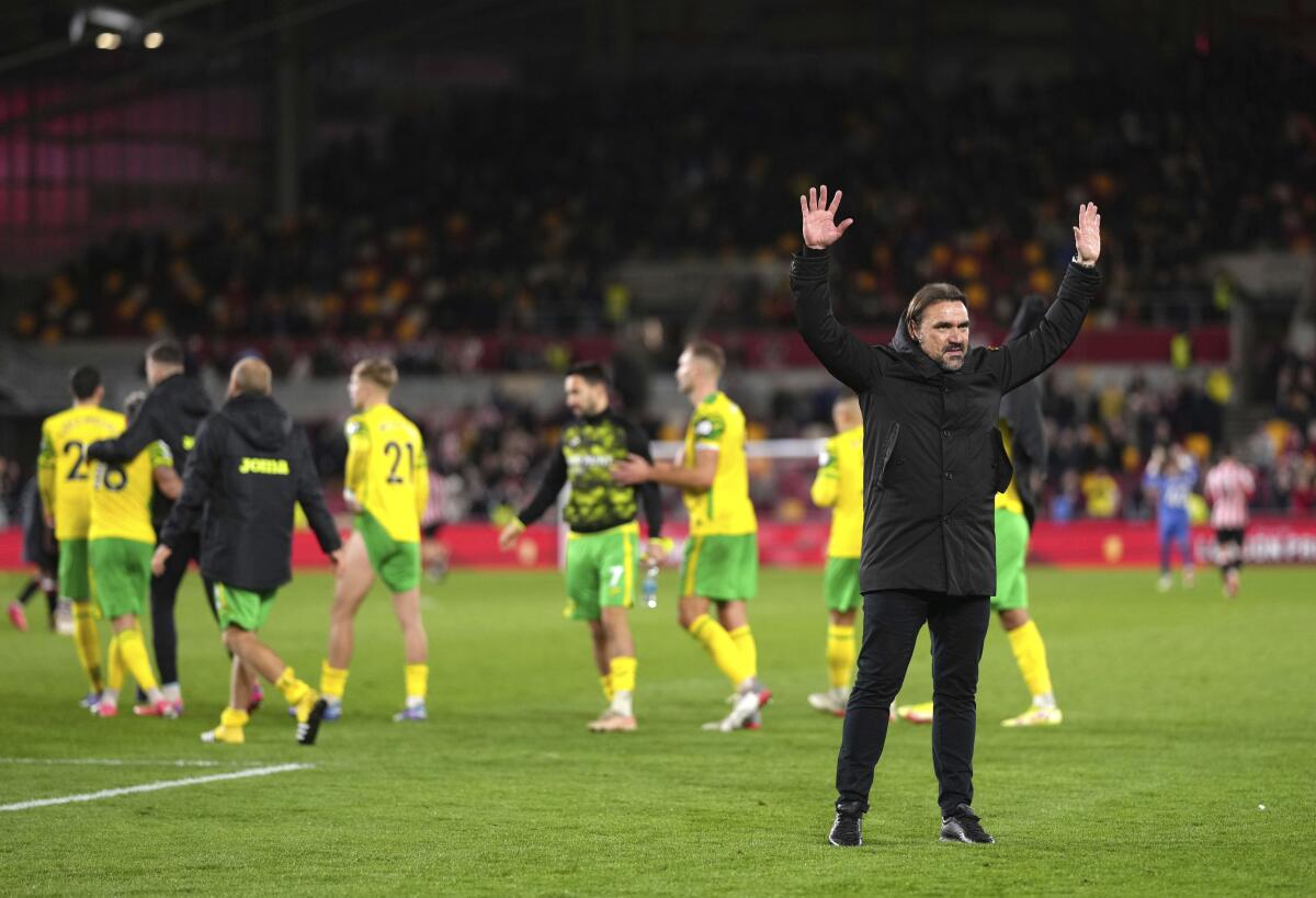 Norwich City manager Daniel Farke salutes the fans after the final whistle of the English Premier League soccer match between Brentford and Norwich City, at Brentford Community Stadium, in London, Saturday, Nov. 6, 2021. Norwich fired manager Daniel Farke despite leading the club to its first win since gaining promotion back to the Premier League. (John Walton/PA via AP)