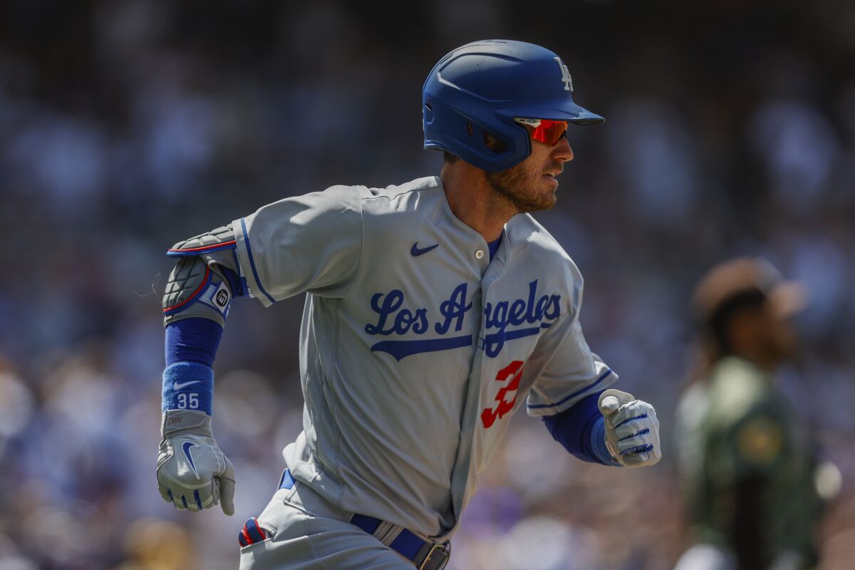 Dodgers center fielder Cody Bellinger runs to first base against the San Diego Padres on April 24.