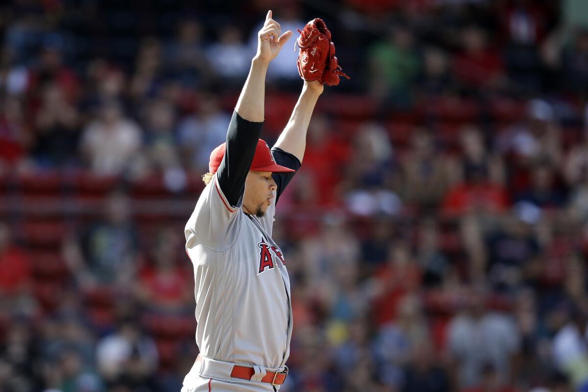 Angels reliever Hansel Robles celebrates after striking out Boston's Christian Vazquez to seal the win Sunday.