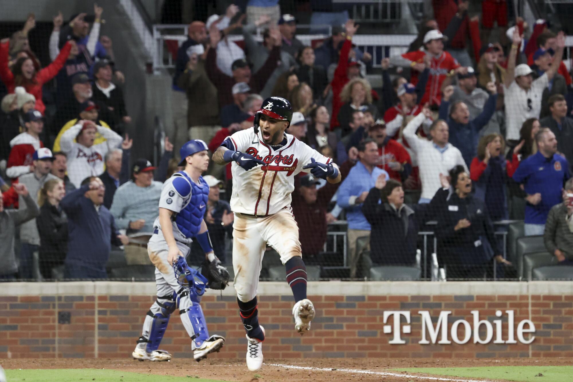Eddie Rosario celebrates after hitting a walk-off single to defeat the Dodgers 5-4.