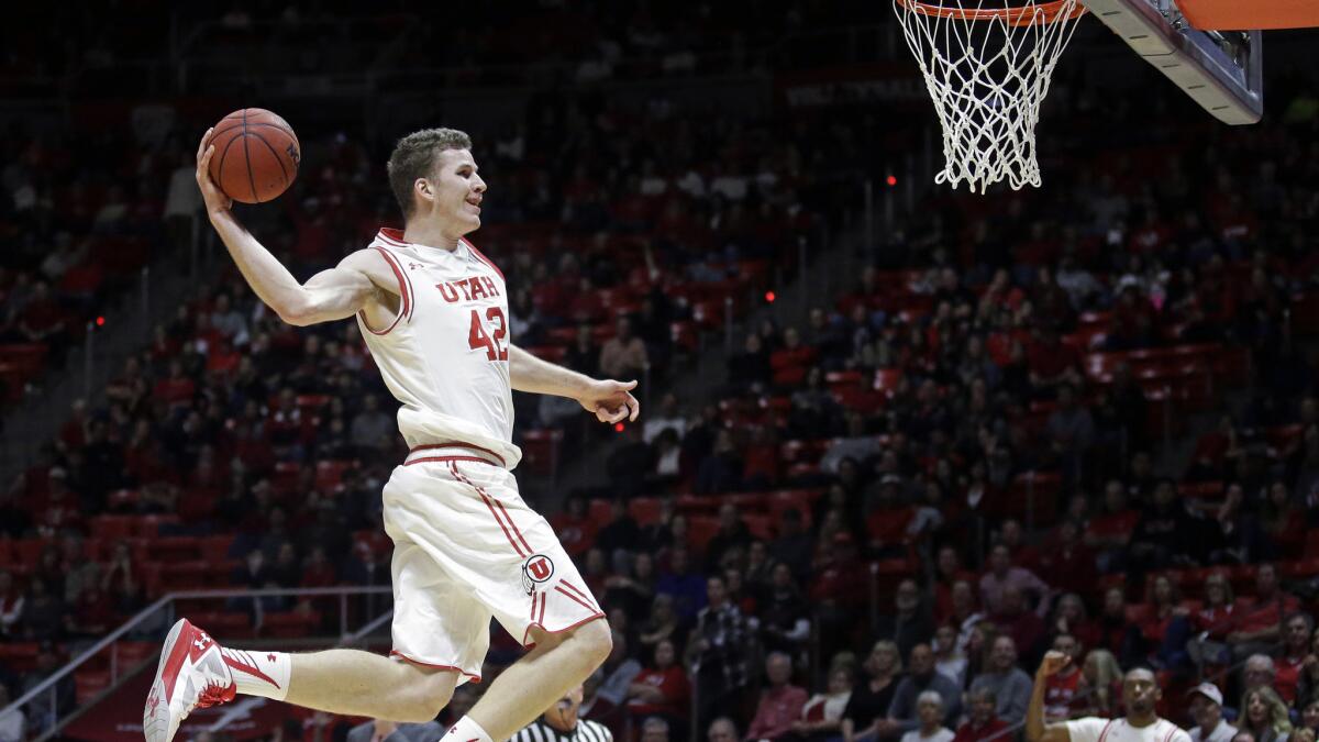 Utah forward Jakob Poeltl (42) goes to the basket for a dunk against Washington State during the second half Sunday.
