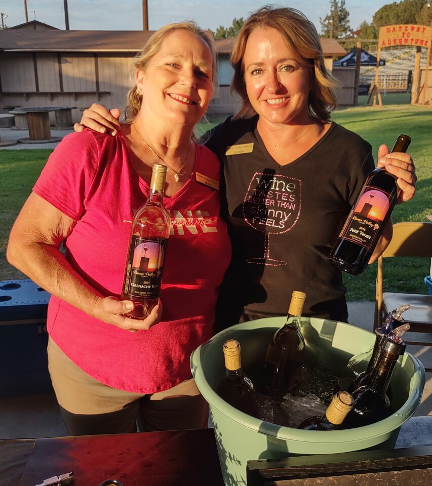 Pamo Valley Winery Tasting Room Manager Marti Hickle, left, and owner Jennifer Lane pour wine for guests at the wine fest.
