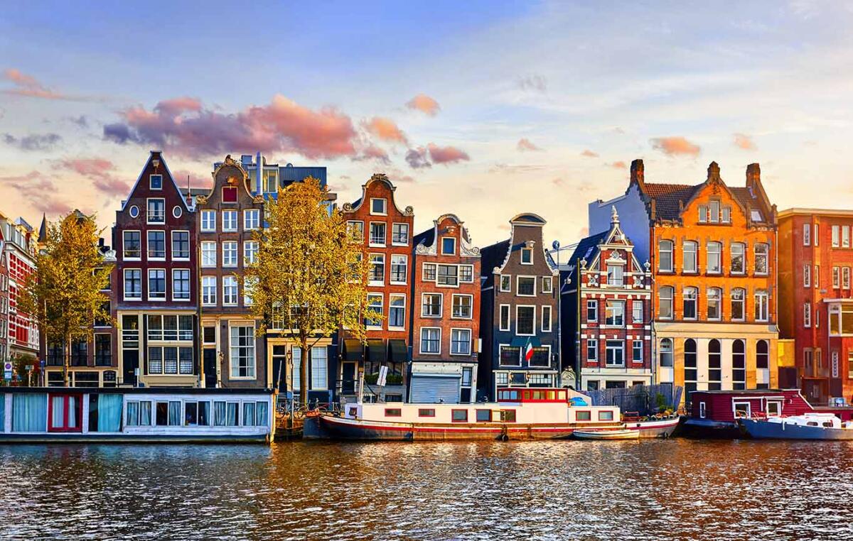 Amsterdam Netherlands dancing houses over river Amstel landmark