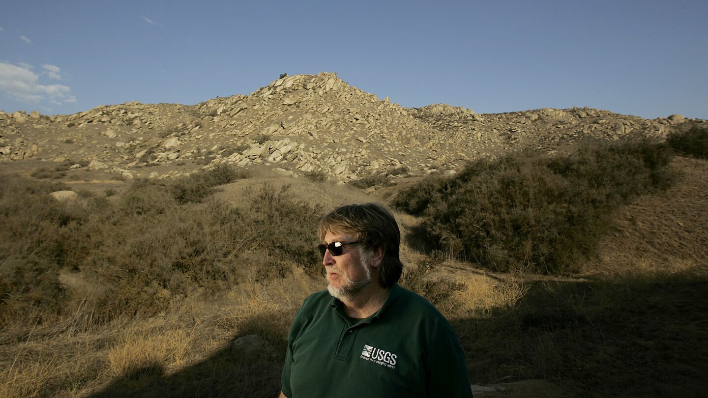 Federal researcher Jon Keeley at Box Springs Mountain Reserve in Riverside County. Frequent fires have destroyed the native shrubs on the hillsides, which are now covered with invasive grasses.