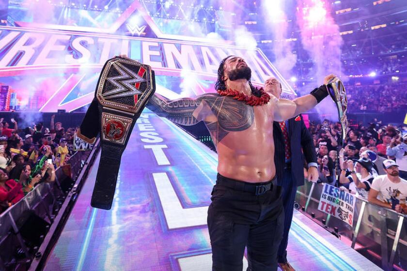 Roman Reigns with Paul Heyman at a previous WrestleMania.